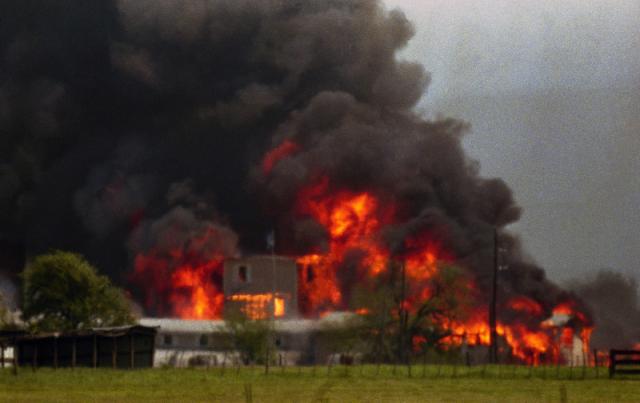 FILE - Fire engulfs the Branch Davidian compound near Waco, Texas, in this April 19, 1993 file photo. (AP Photo/Ron Heflin, File) (The Associated Press) 