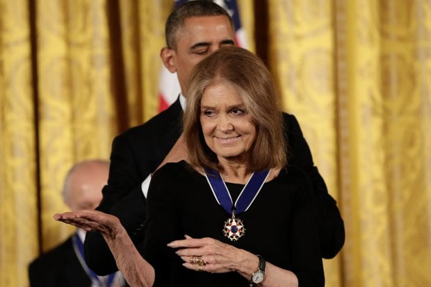 Gloria Steinem receives her Presidential Award on November 20, 2013 for causing the nation to violate God’s Law on the woman question and on aborticide.