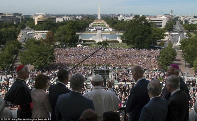 Pope Francis, accompanied by members of Congress, waved to the crowd from the Speakers Balcony on Capitol Hill in Washington.